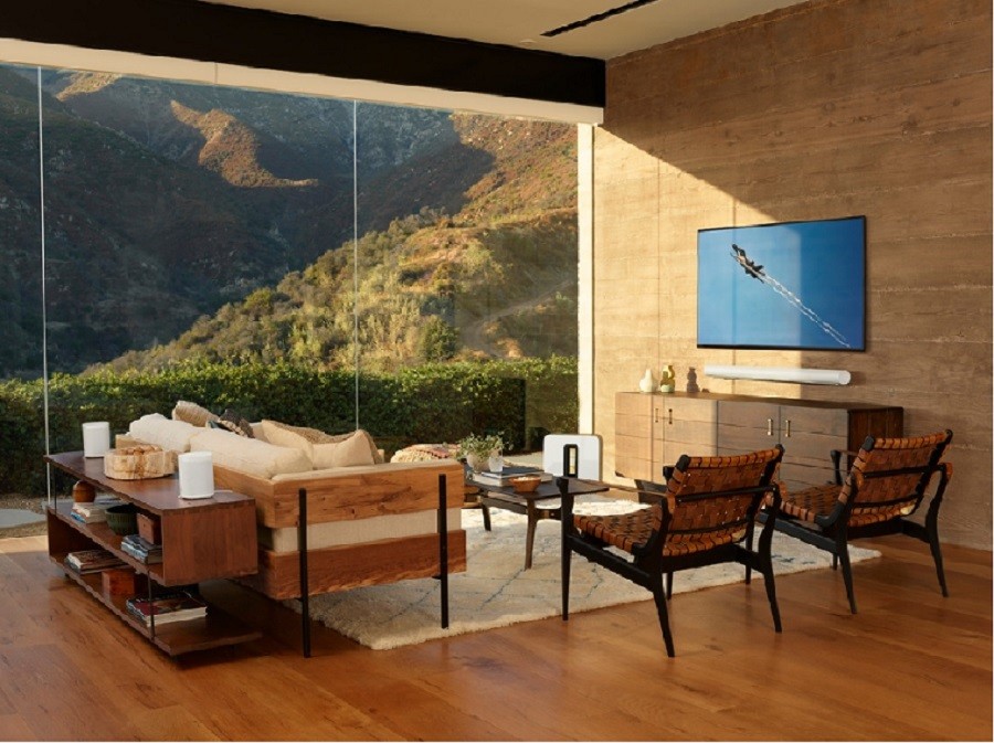Sophisticated living room with Sonos speakers overlooking the mountain range. 