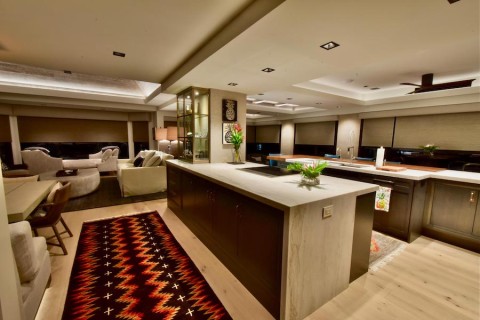 open-concept kitchen, dining and living room space with recessed smart lighting fixtures